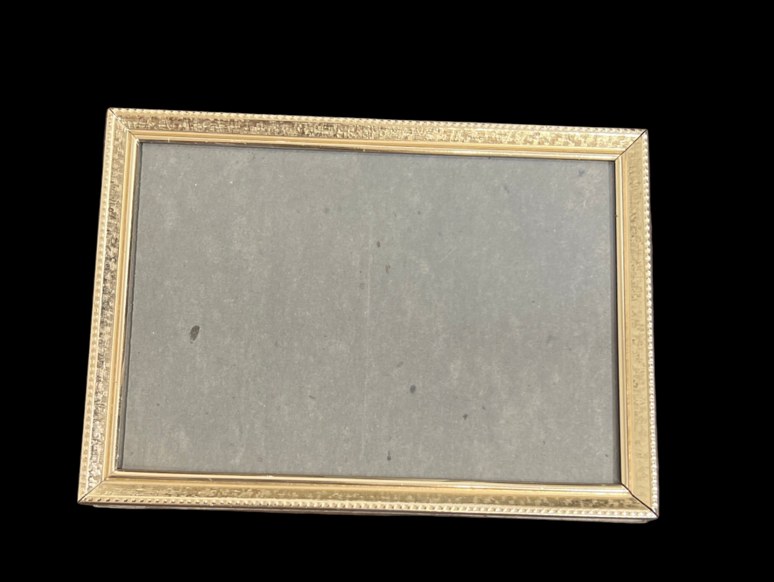 Gold tone metal frame